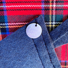 Load image into Gallery viewer, Closeup of the stamped logo sewn on the backside of the pennant
