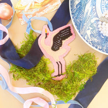 Load image into Gallery viewer, Chinoiserie crane ornament styled on top of blue and pink ribbons and blue and white china