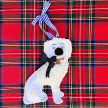 Load image into Gallery viewer, Left Staffordshire Poodle Ornament with a Navy Bow on a Red Plaid Background