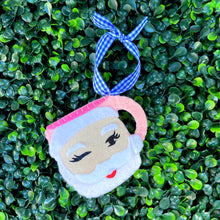 Load image into Gallery viewer, Winking Santa Mug Ornament in Pink on Greenery