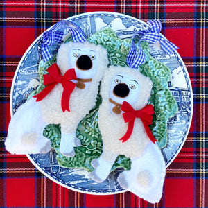 Pair of Staffordshire Poodle Ornaments on a plate