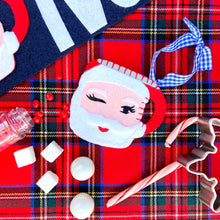 Load image into Gallery viewer, Winking Santa Mug in Red In Flat Lay