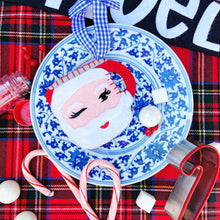 Load image into Gallery viewer, Winking Santa Mug Ornament in Red on a Blue and White Plate